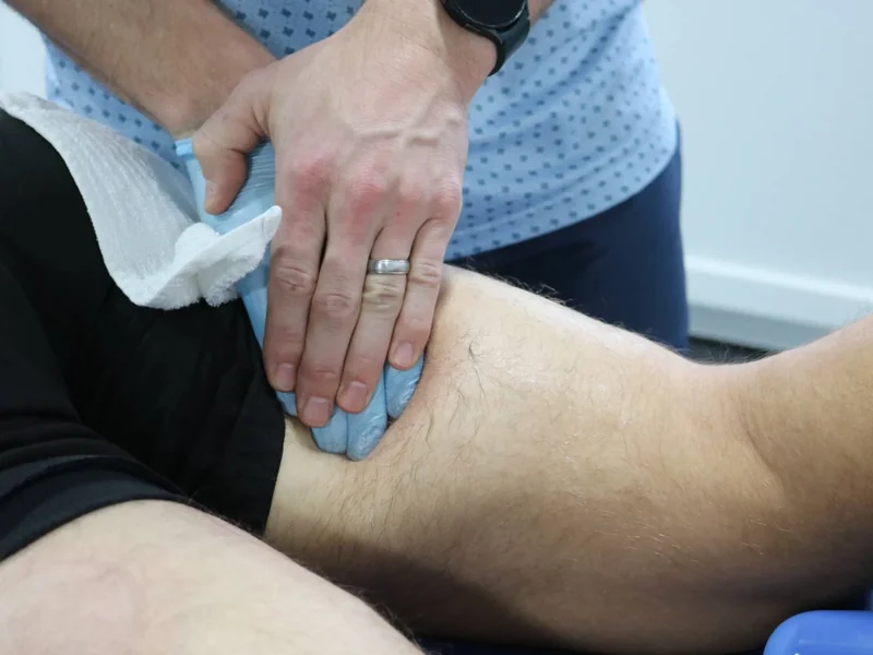 Physical therapist providing hands-on treatment to calm acute pain