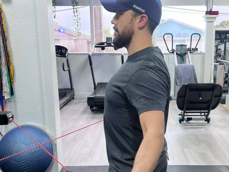 Patient working through guided mobility exercises with a therapist