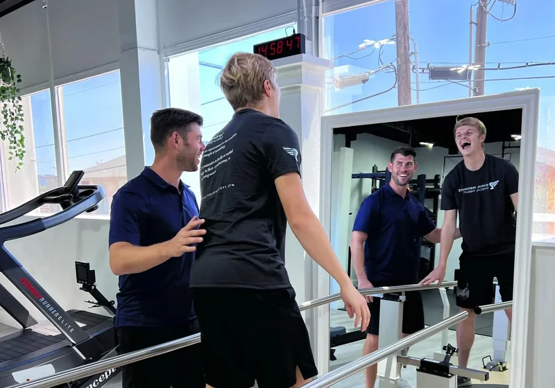 Athlete performing a loaded return-to-sport drill with a Doctor of Physical Therapy