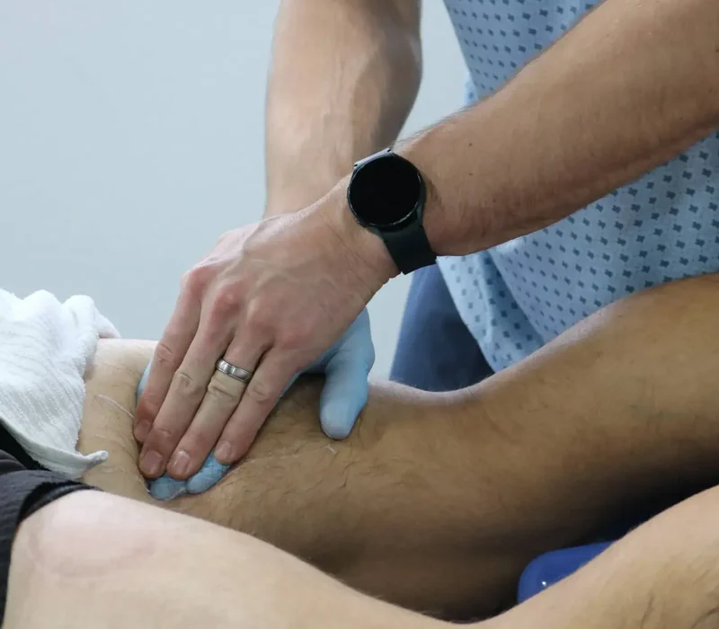 Therapist performing hands-on joint mobilization