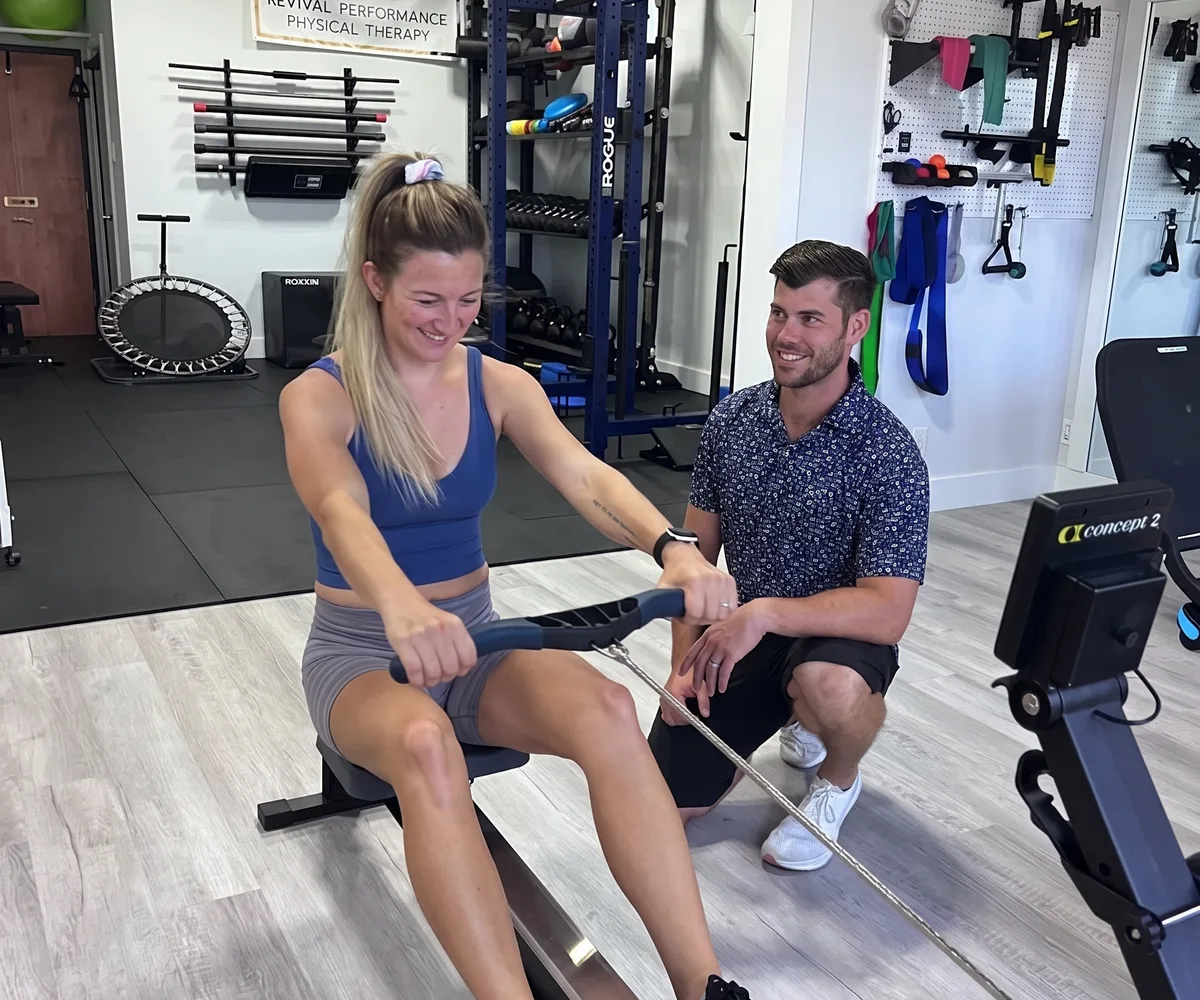 Physical therapist guiding a patient through a hands-on treatment session