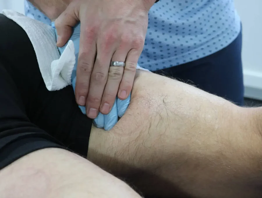 Physical therapist guiding a patient through a one-on-one session